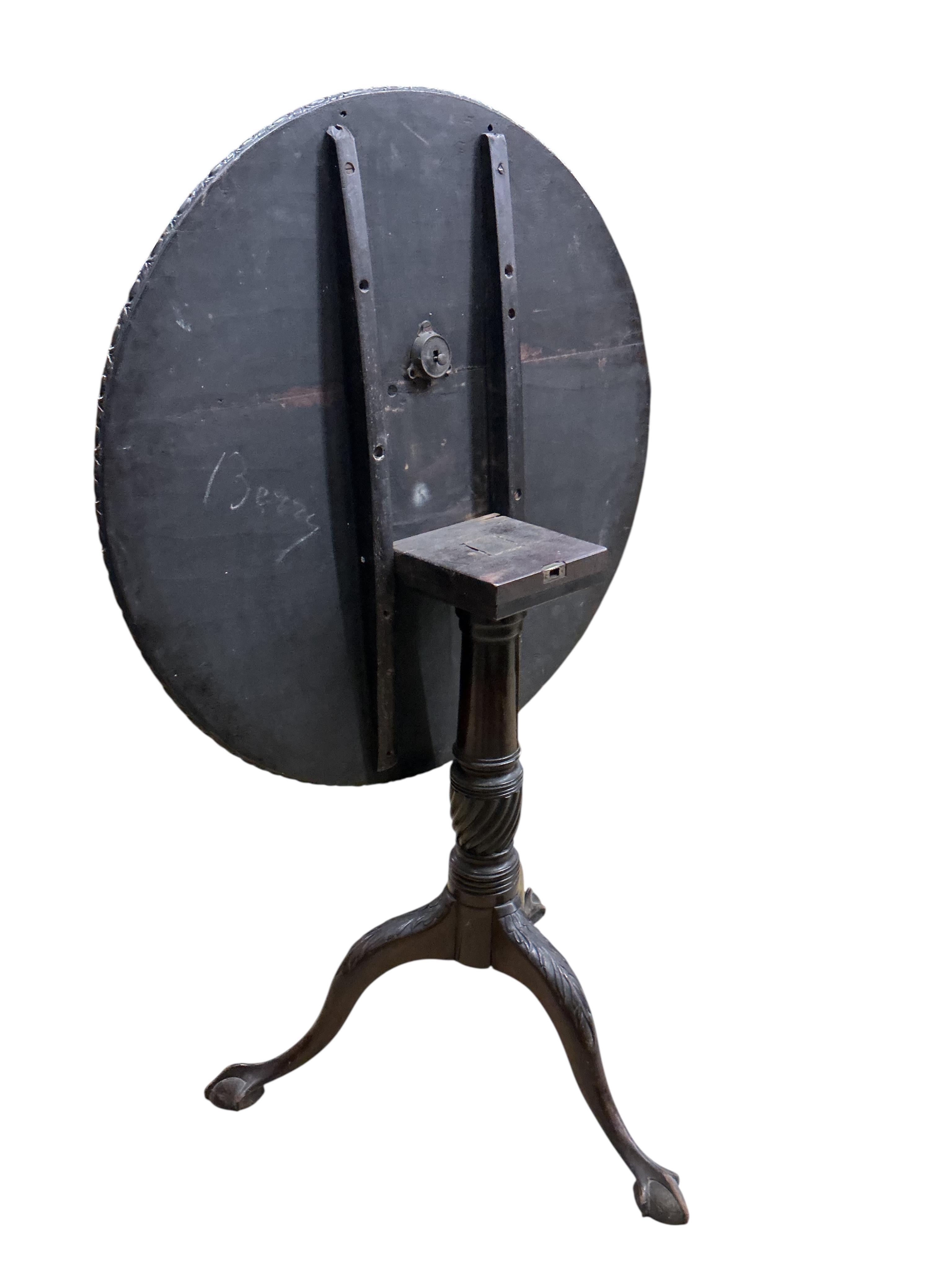 A George III style circular mahogany tilt top tripod tea table, diameter 74cm, height 70cm